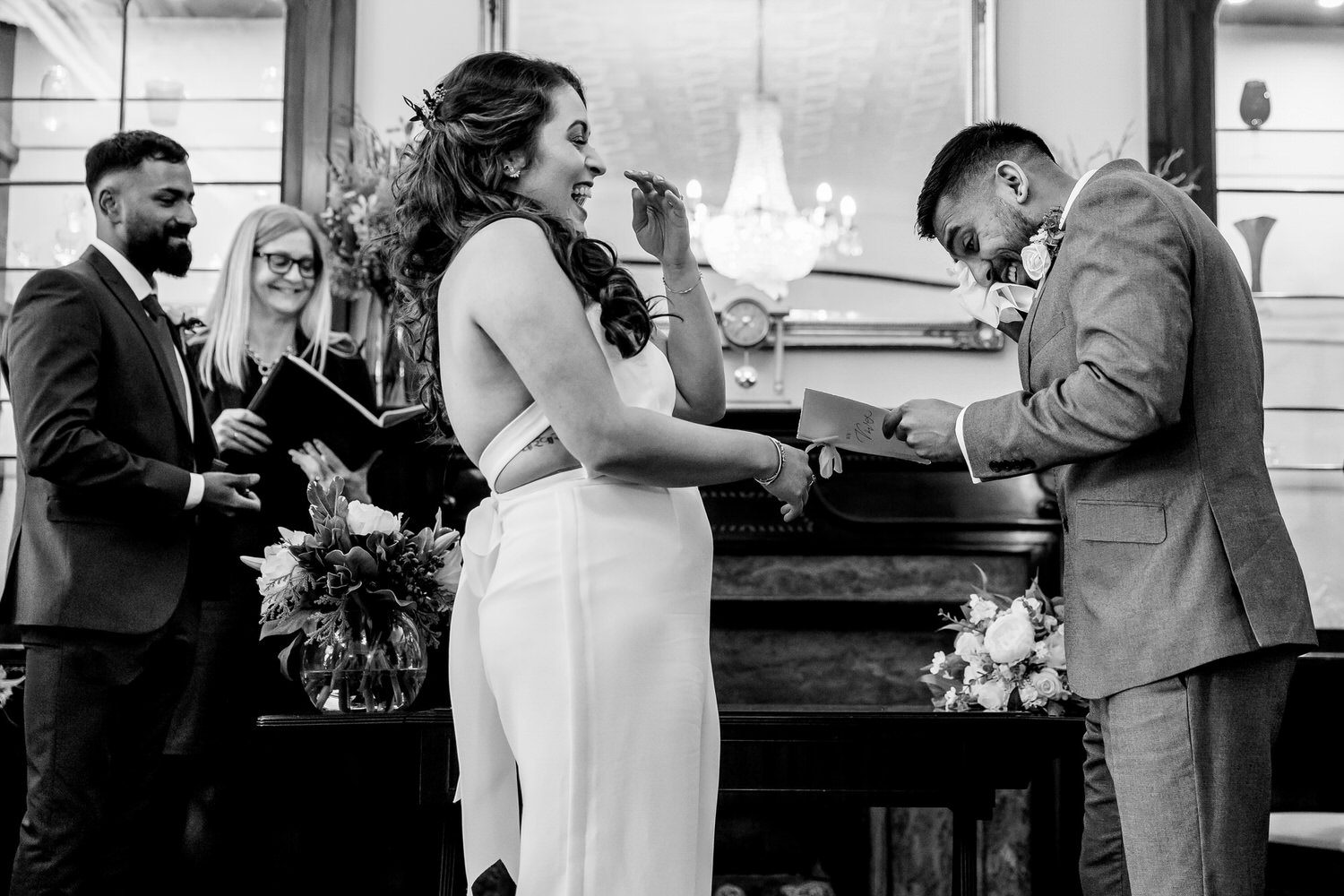 Bride and Groom reading their wedding vows