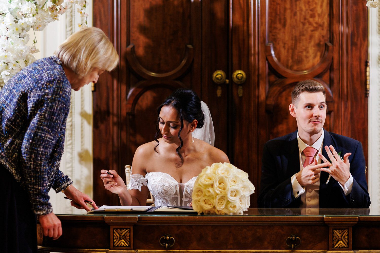 Fusion wedding couple signing registration