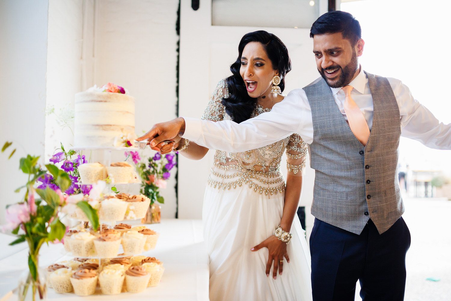Wedding couple cutting cake