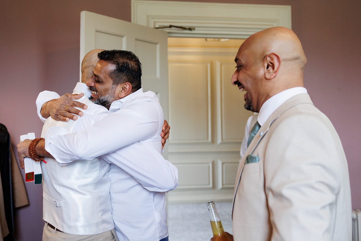 Grooms party hugging