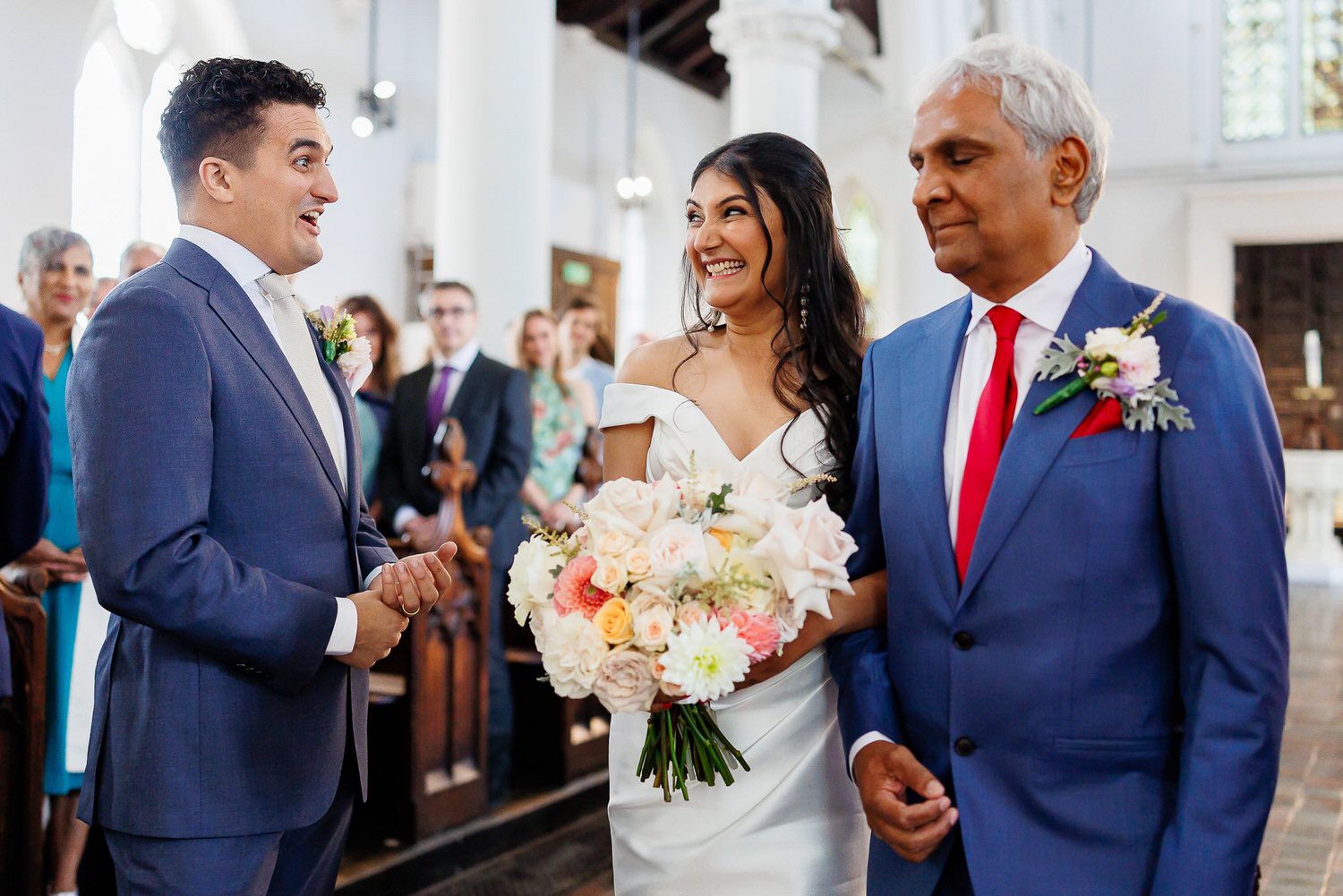 Bride and groom smiling at each other