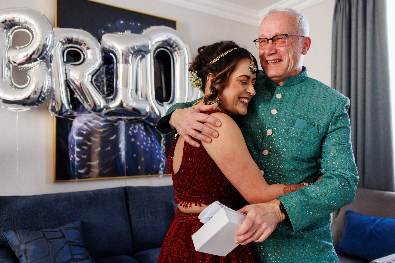 Bride hugging her father