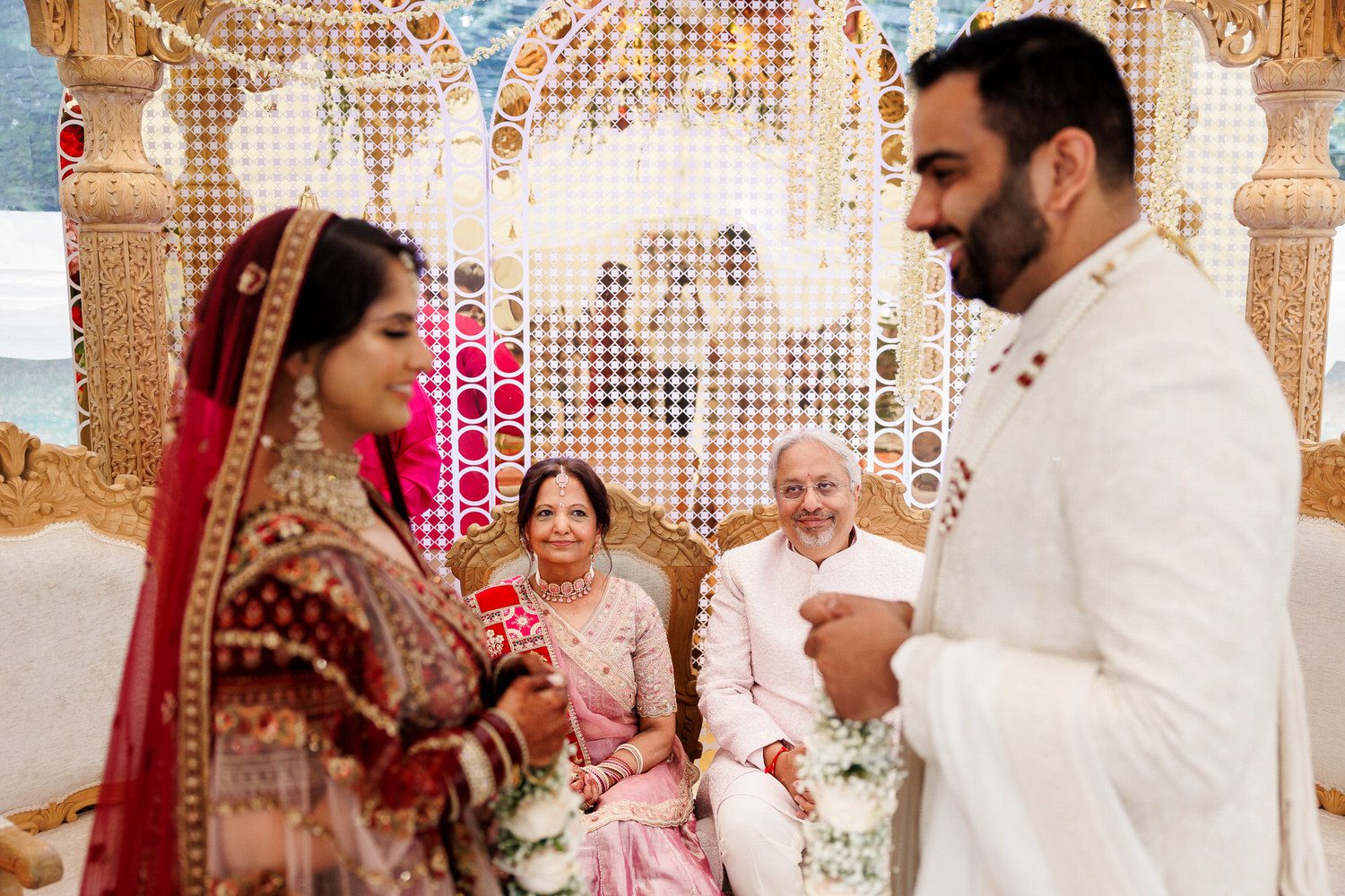 Indian bride's parents looking at couple