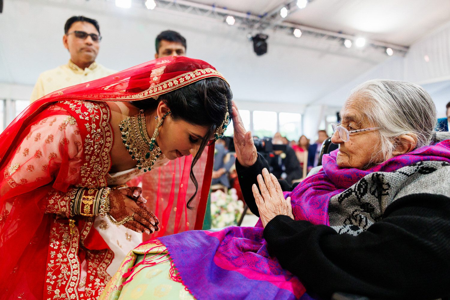 bride to be getting blessings from elders