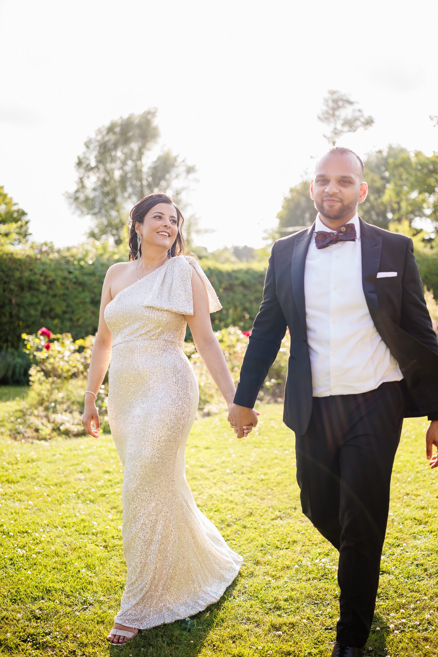 Bride and groom walking portrait