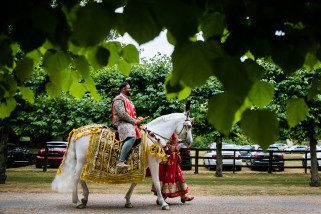 Asian Wedding groom arrival on horse