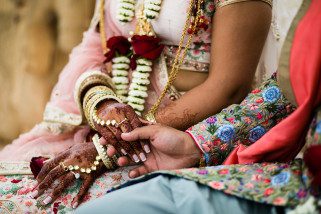 Bride and Groom holding hands