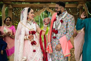 Bride and Groom holding hands