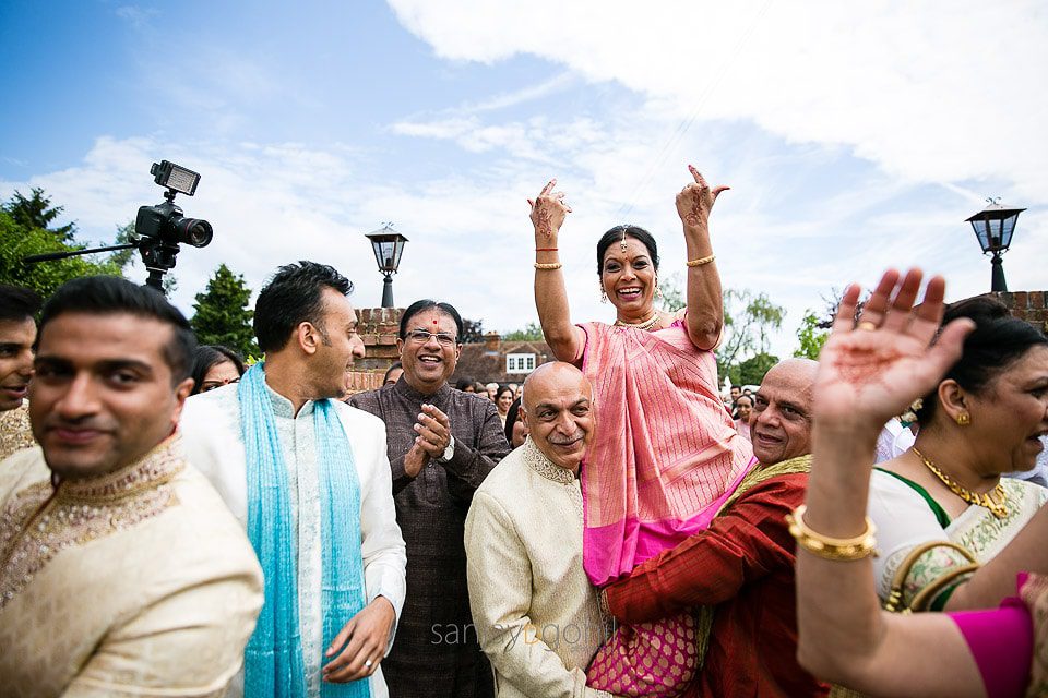 Mother of the bride being lifted