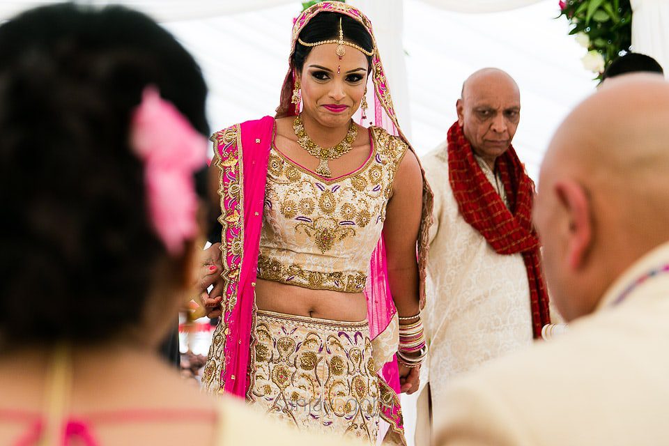 Asian Wedding bride smiling at her mum