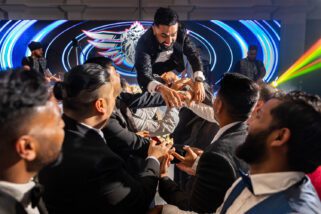 Groom's stage dive at wedding reception