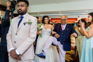 Father of the bride kicking groom