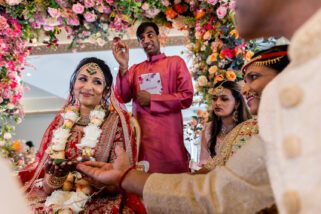 Bride smiling at mother during Hindu wedding ceremony