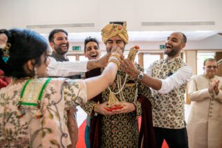 Mother of the bride pulling grooms' nose