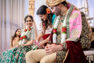 Bride and groom being tied together