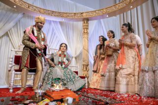 Bride sits down before the groom