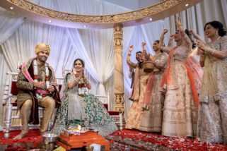 Bride sits down before the groom