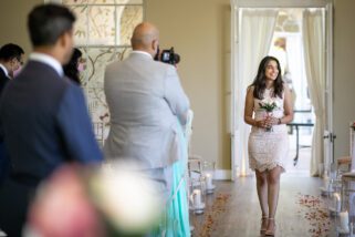 Bridesmaid walking down the isle