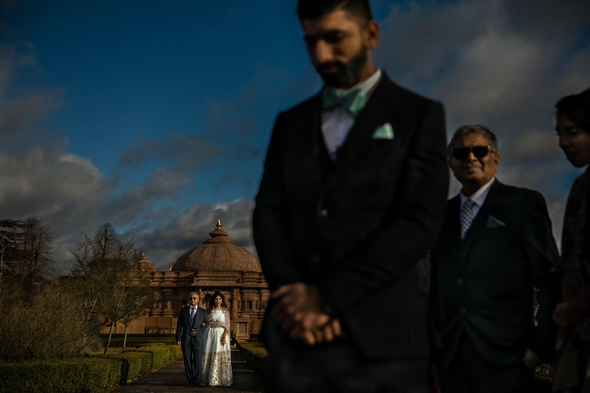 Bride walking towards groom during civil ceremony