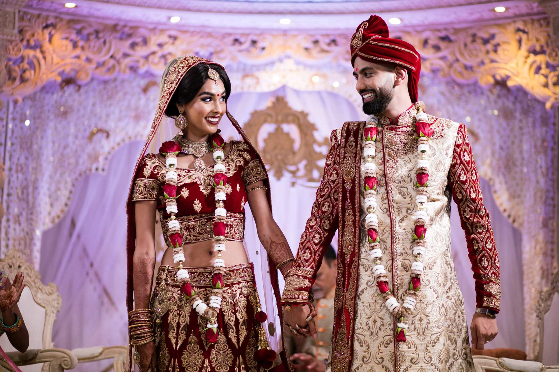 Bride and Groom smiling at each other