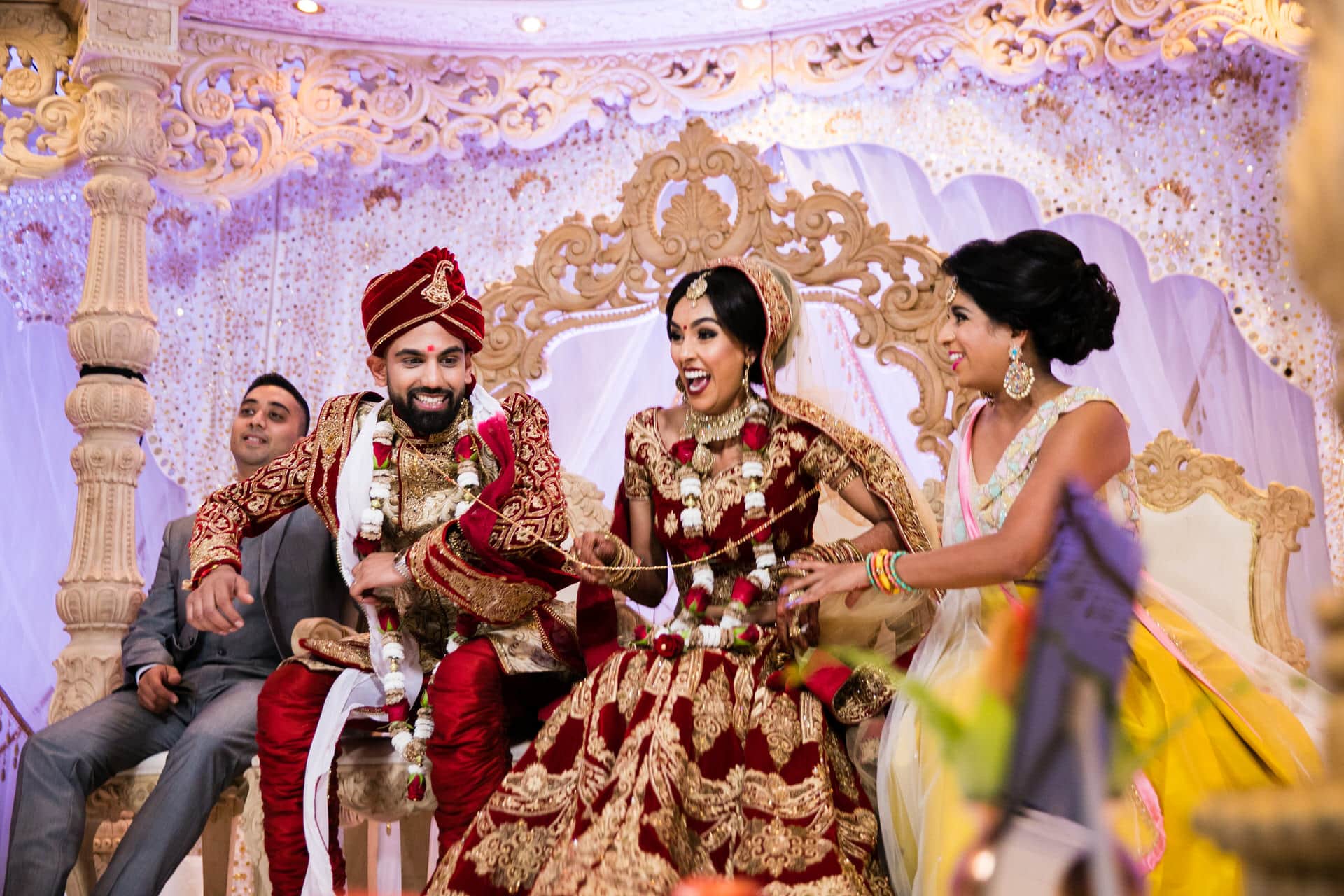 Bride sits down before groom