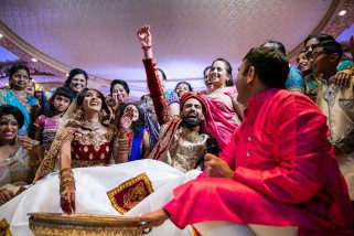 Indian bride and groom playing koda kodi