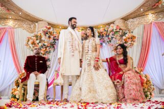 Bride and groom smiling in mandap