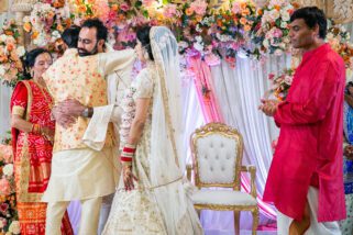 Groom hugging father of the bride
