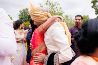 Groom hugging