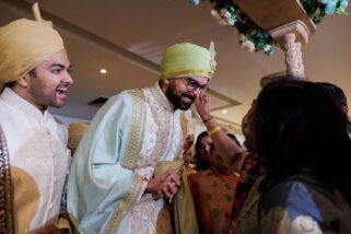 Groom's nose being pinched