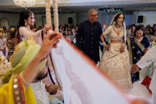 Asian wedding bride arriving at wedding