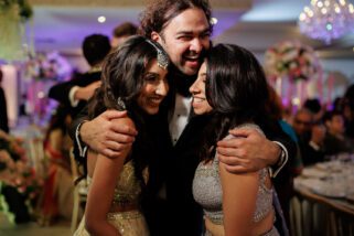 Family hugging at wedding