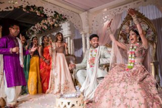 Bride sits down before groom