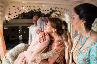 Bride hugging mother