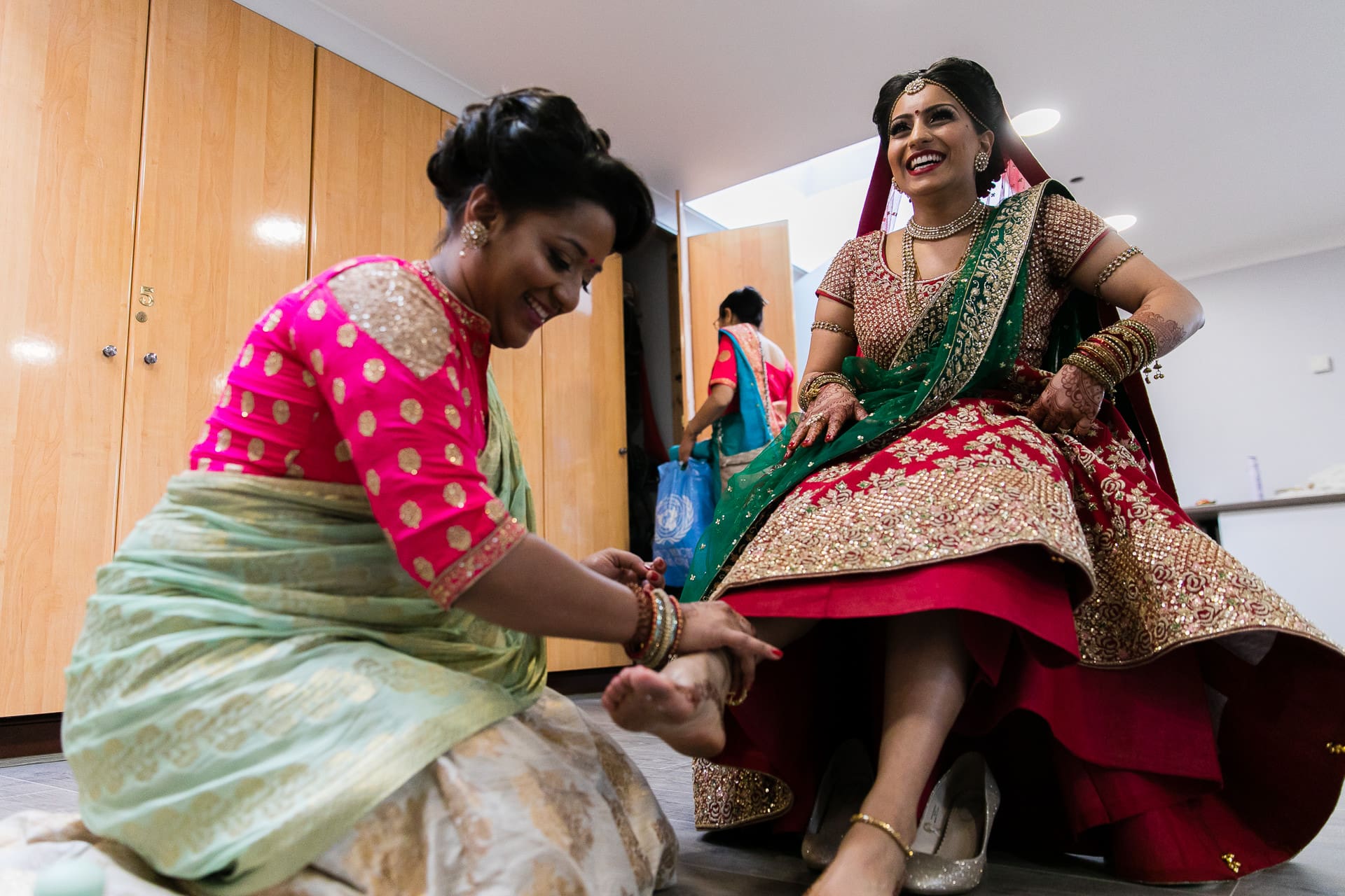 Bride having her feet cleaned