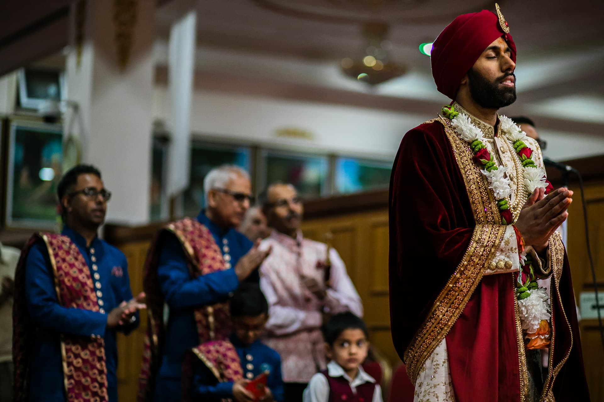 Groom praying inside Willesden Mandir