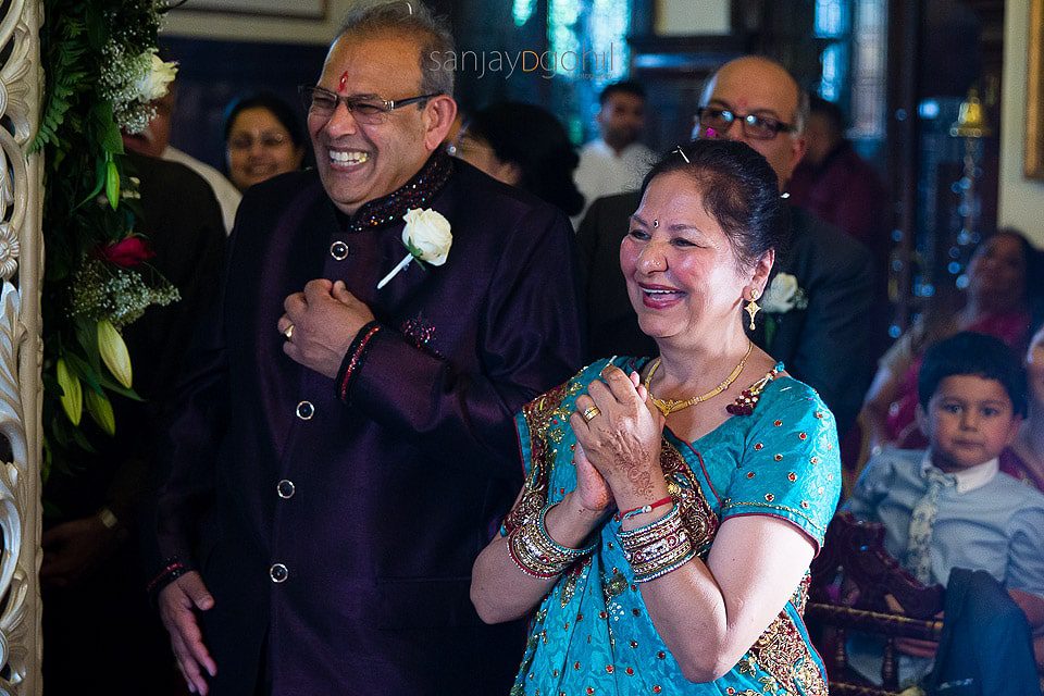 Parents of the groom laughing