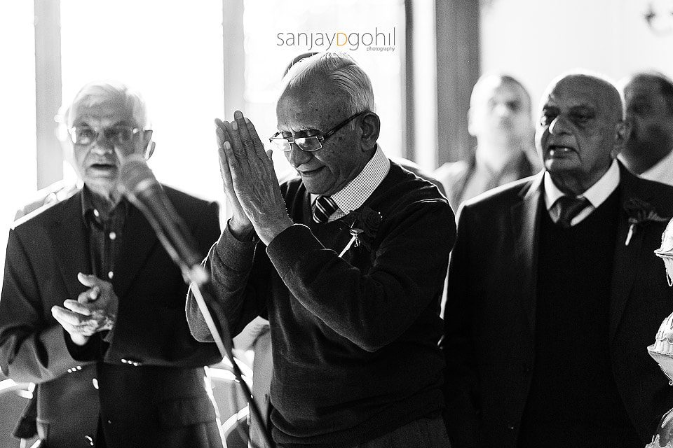 Hindu Wedding guest praying