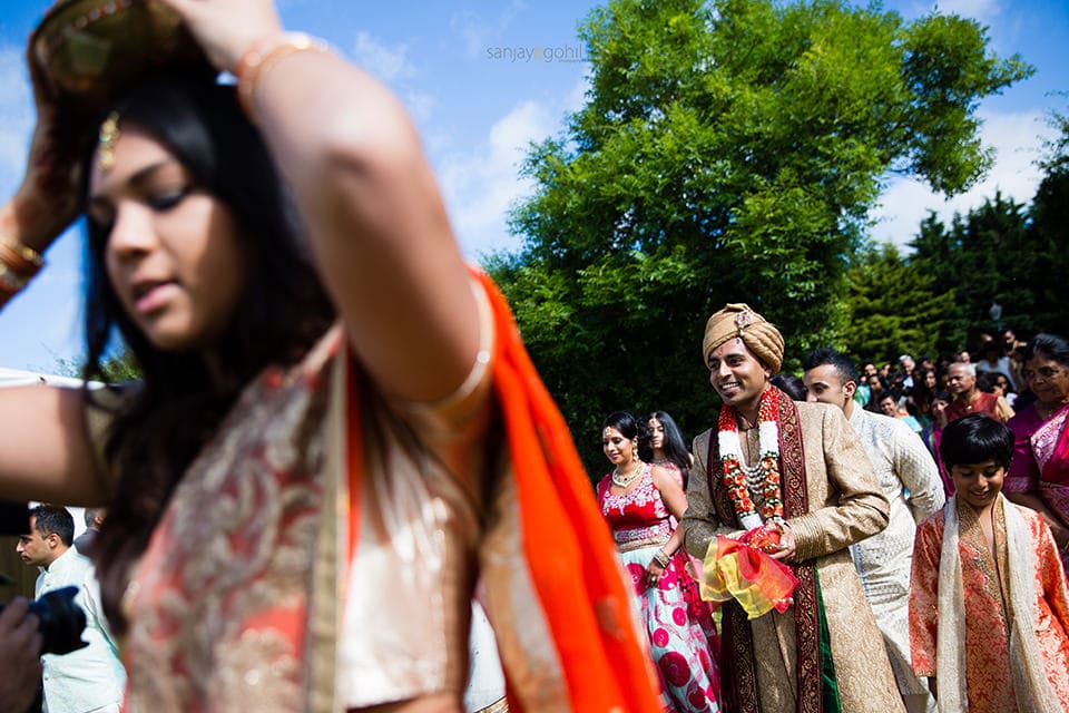 Hindu Wedding groom walking to mandap