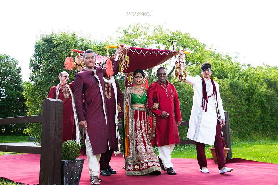 Hindu Wedding bride arriving with uncles