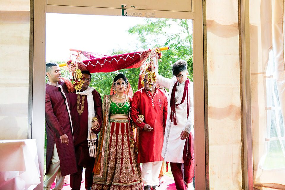 Hindu Wedding bride arriving with uncles