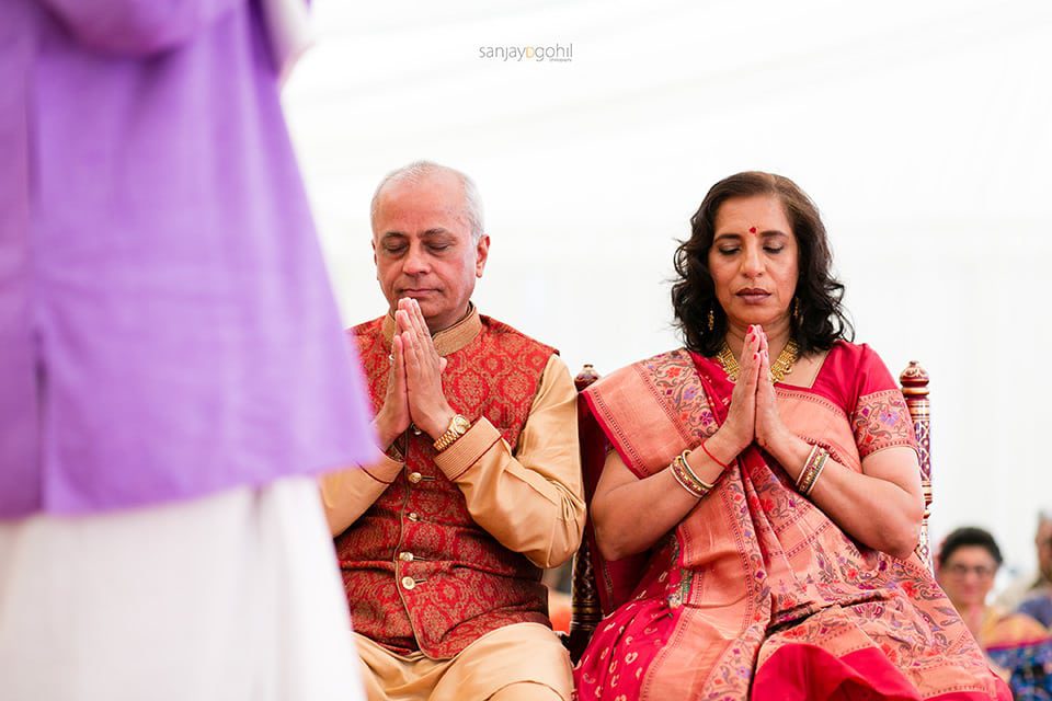 Groom's parents praying