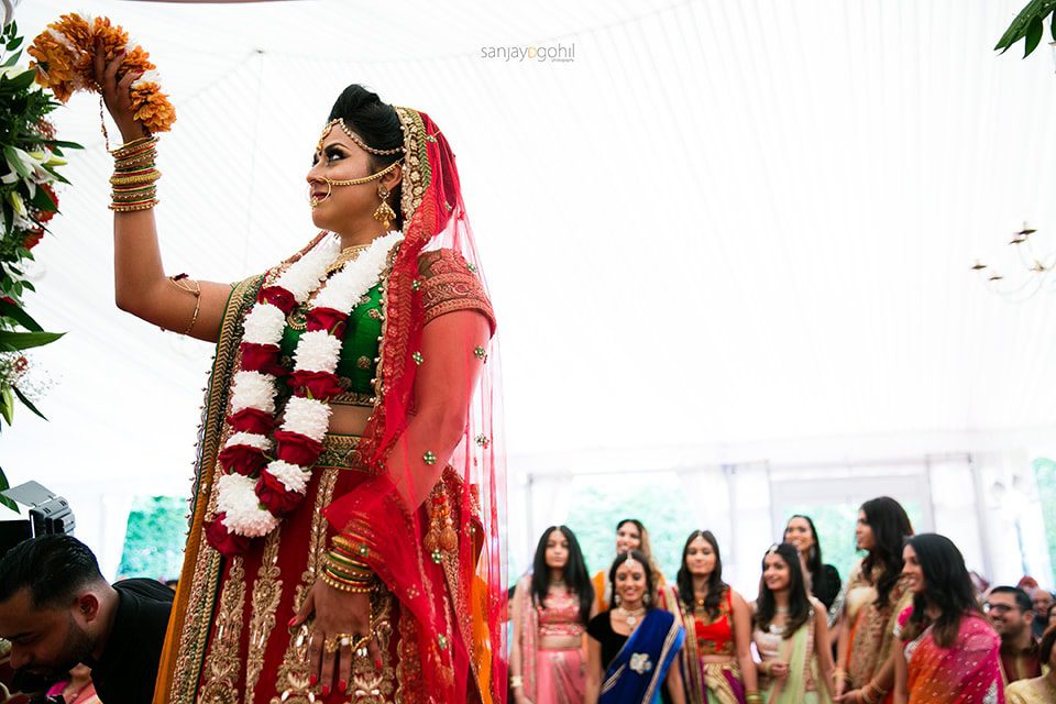 Bride throwing garland