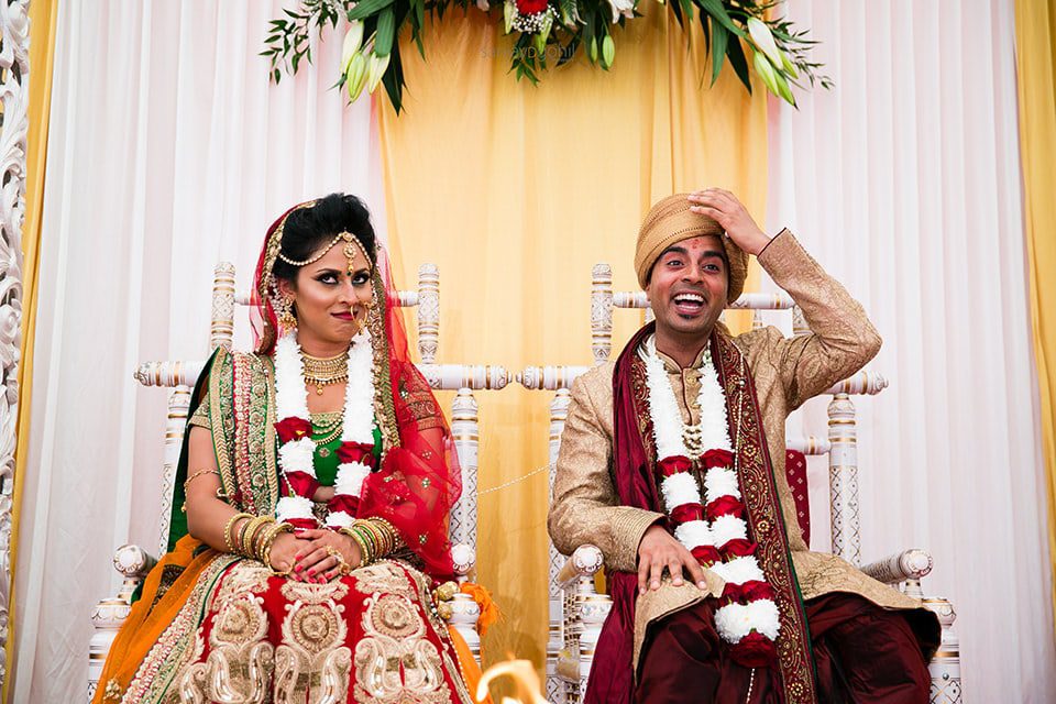 Funny facial reaction between bride and groom