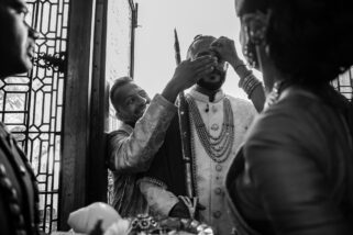 Best man protecting grooms nose