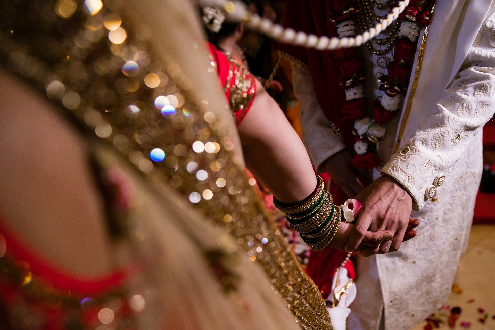 Bride and groom holding hands