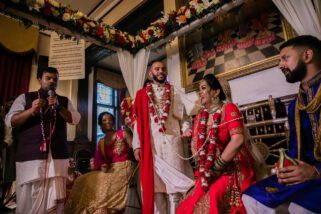 Asian Bride sits down before groom