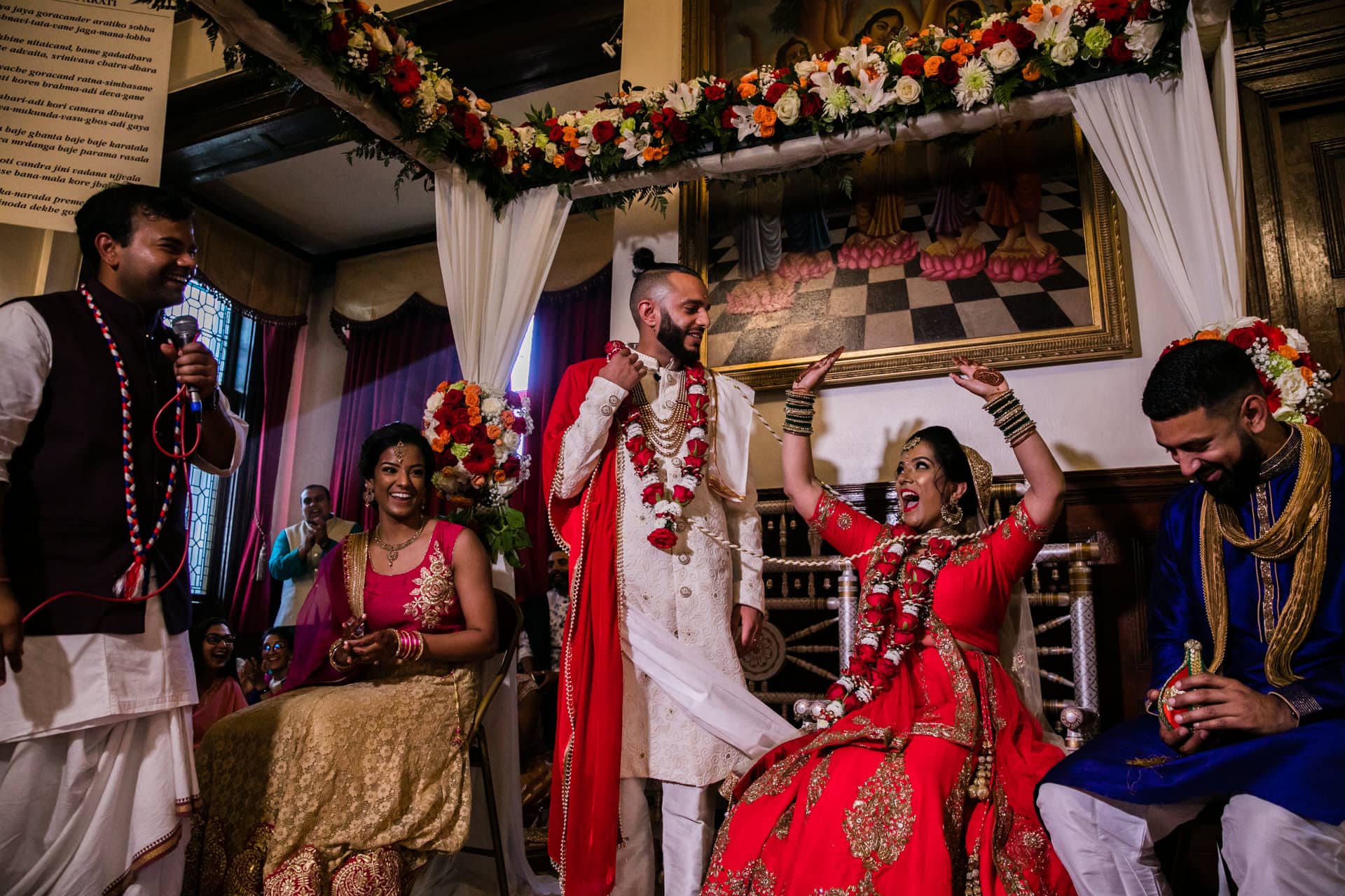 Asian Bride sits down before groom