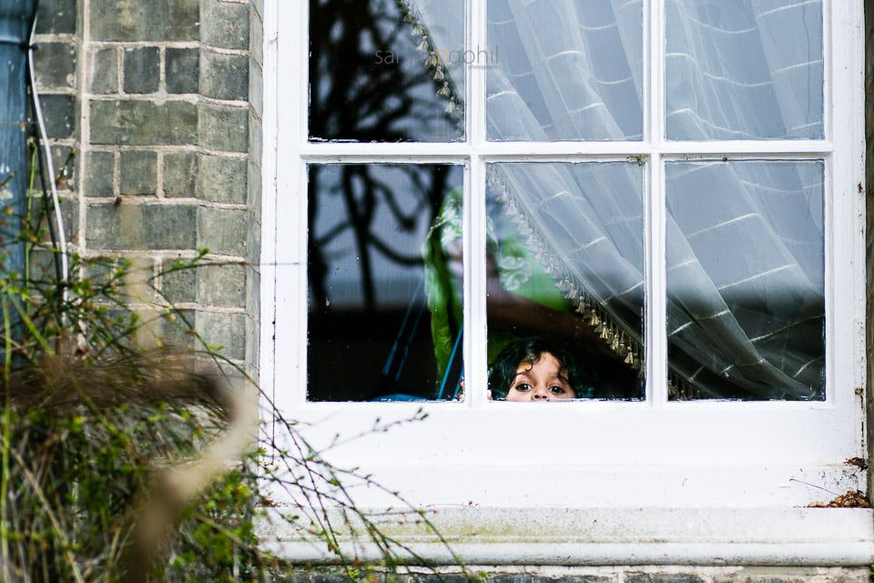 Wedding guest looking through the window