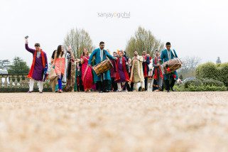 Groom's wedding party arrival with dhol players